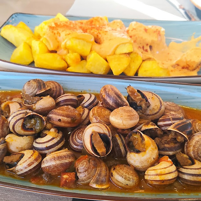 Patatas Bravas Y Caracoles En Salsa