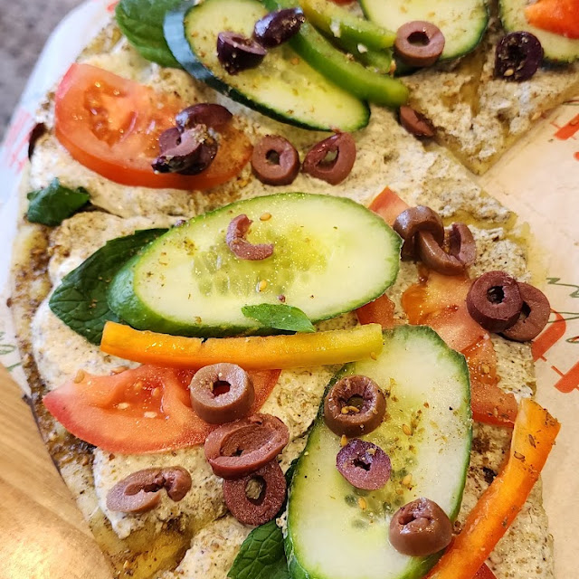 Zaatar Topped with Yogurt Dip with Fresh Mint Cucumber and Tomatoes