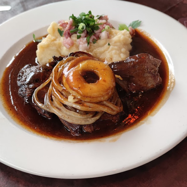 Leg of Pork Braised in Dark Beer with Sauerkraut and Bread Dumpling
