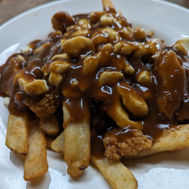 Poutine with Breaded Chicken and Canadian Bacon