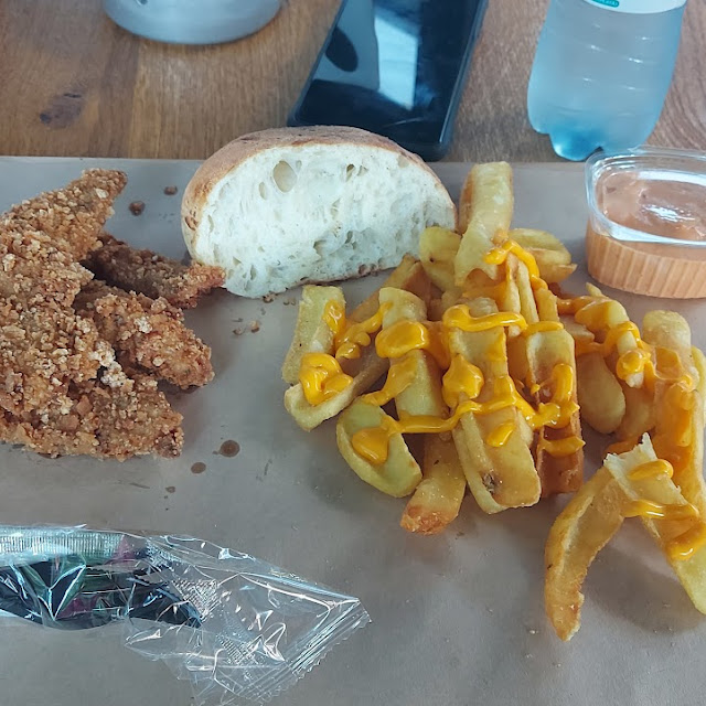 Crispy Chicken Strips and Fries with Cheese