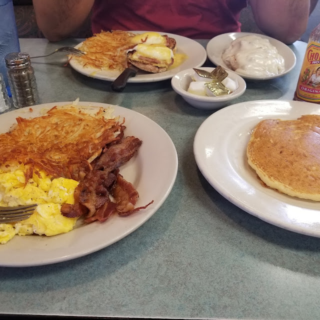 Two Egg Breakfast with Sourdough Toast Hash Browns and a Side of Grits