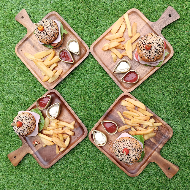 Hamburger Combo with Different Sauces Accompaniend by Freshly Cut Potatoes
