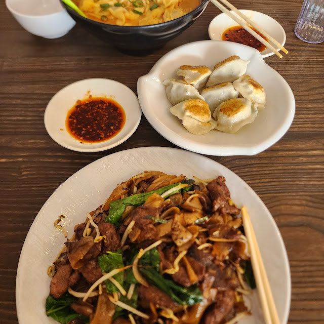 Wontons in Laksa Fries Pork and Chive Dumpling and Stirfried Flat Rice Noodles with Beef