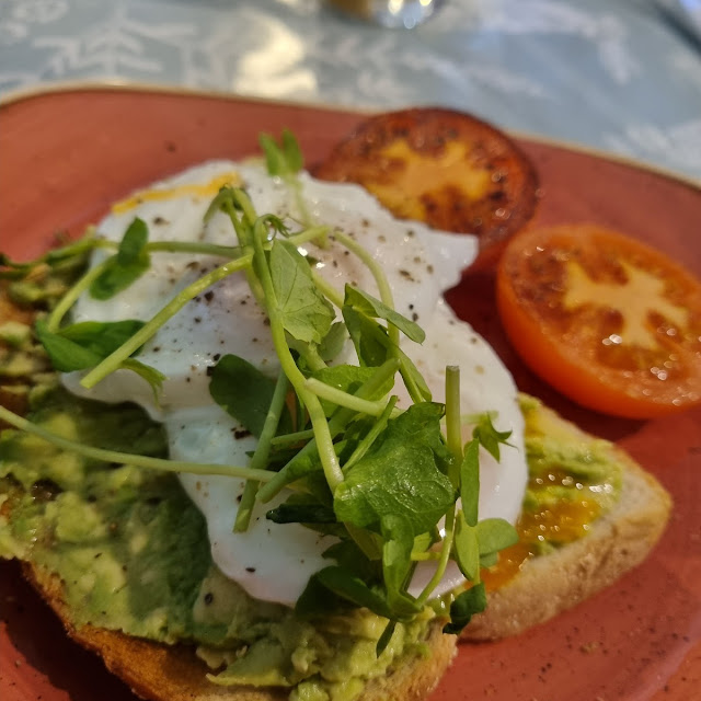 Smashed Avocado with Poached Egg and Grilled Tomatoes