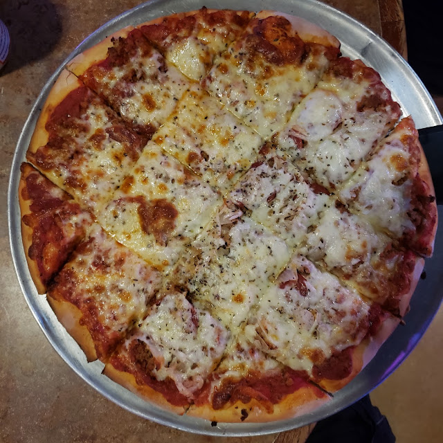 Pepperoni and Ground Sausage Pizza w Onions on Half