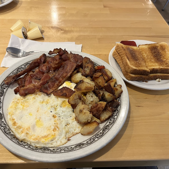 Two Eggs Breakfast with Bacon and White Toast