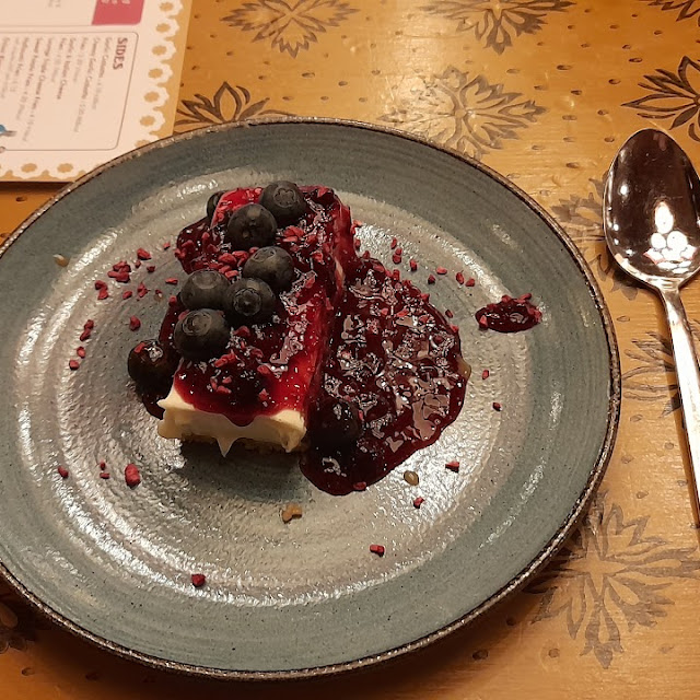 Midwinter Black Forest Cheesecake with Cherry Compote and a Dusting of Chocolate Flakes