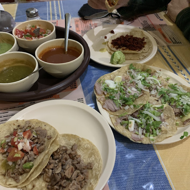 Bistec Tacos On The Left And Tacos Al Pastor On The Right