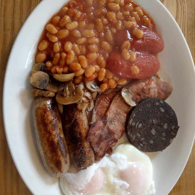Traditional Breakfast with Poached Egg and Black Pudding