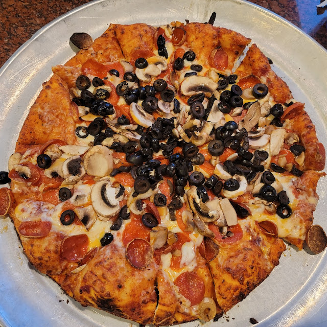 Pepperoni Olive and Mushroom Pizza