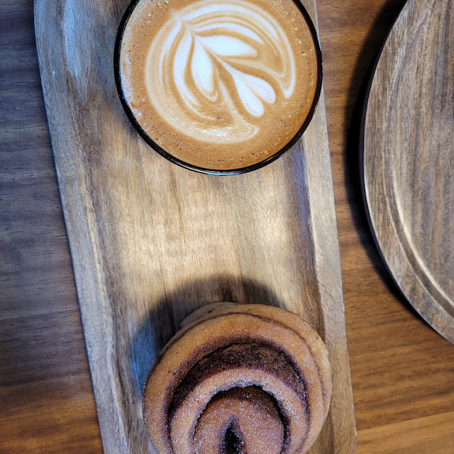 Oat Flat White and Cinnamon Bun