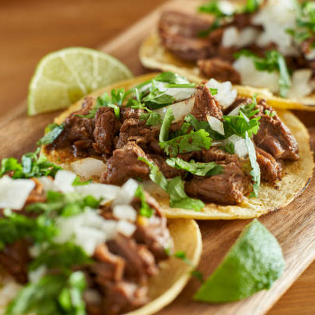 Homemade Pork Carnitas Tacos with Cilantro and Onion