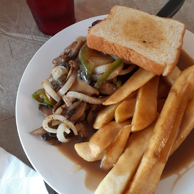 Hamburger Steak with Mushroom Gravy Peppers and Onions Steak Fries and Texas Toast